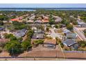 Aerial view of a home with a screened-in pool and spacious backyard in a residential neighborhood at 8702 Master Link Ct, Orlando, FL 32836