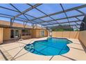 Relaxing screened-in pool area, perfect for outdoor entertaining and enjoying the Florida sunshine at 8702 Master Link Ct, Orlando, FL 32836
