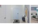 Stylish home entryway with decor leading to a beautifully decorated bedroom at 880 Paradise Dr, Davenport, FL 33897