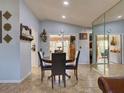 Inviting dining area with tile flooring and modern mirror accents at 929 Monroe Harbor Pl, Sanford, FL 32773