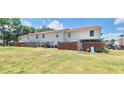 Spacious backyard featuring a privacy fence and ample green space for outdoor enjoyment at 980 Canal View Blvd # N2, Port Orange, FL 32129
