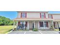 Inviting condo with cozy front porch, red shutters, and space to add your personal touch at 980 Canal View Blvd # N2, Port Orange, FL 32129