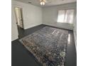 Spacious bedroom with fresh paint and a large rug at 111 E 8Th St, Sanford, FL 32771