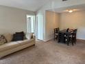 Cozy living room with sofa, dining area and view of the bedroom at 224 Afton Sq # 301, Altamonte Springs, FL 32714