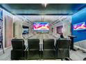 Incredible game room featuring surround sound, theater seating, a large flat screen TV, and custom lighting at 2609 Dinville St, Kissimmee, FL 34747