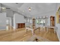Spacious living room with hardwood floors, high ceilings, and sliding glass doors at 288 Englenook Dr, Debary, FL 32713