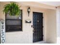 Inviting front entrance featuring a stylish black door and decorative accents at 4015 Kirkland Blvd, Orlando, FL 32811