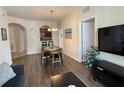Cozy living room with wood floors, dining area, and archway to the kitchen at 4024 Breakview Dr # 40604, Orlando, FL 32819