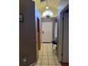 Inviting entryway with tiled flooring, high ceilings, and a decorative window above the front door at 6518 Garden Spring Ct, Orlando, FL 32818