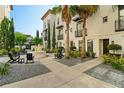 Inviting community courtyard with fountain, lush landscaping, and comfortable outdoor seating at 654 Mariposa St, Orlando, FL 32801