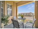 Relaxing balcony area offers a serene outdoor space with neighborhood views at 724 Terrace Ridge Cir # 724, Davenport, FL 33896