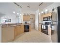 Well-equipped kitchen features modern appliances and ample counter space at 724 Terrace Ridge Cir # 724, Davenport, FL 33896