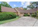 Charming home featuring a two-car garage and a well-manicured front yard at 1107 Monroe Ave, St Cloud, FL 34769