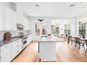 Bright, modern kitchen with stainless steel appliances, a large island, and an open concept design at 1120 Parma Cir, Lake Mary, FL 32746