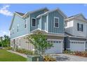 Charming two-story townhome with a large garage and beautiful brick driveway at 1341 Wycliffe Way, St Cloud, FL 34771