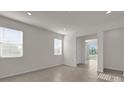 Bright living room with neutral paint, tile floors, recessed lights and natural light from two windows at 1341 Wycliffe Way, St Cloud, FL 34771