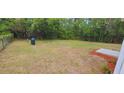 Large, fenced backyard provides ample space for outdoor activities at 1472 6Th Ave, Deland, FL 32724