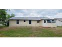 Rear view of a single-story home, showing the back of the property at 1472 6Th Ave, Deland, FL 32724