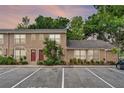 Inviting townhome exterior with lush landscaping and ample parking, perfect for a comfortable living experience at 1523 Casa Park Cir, Winter Springs, FL 32708