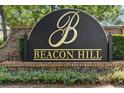 Elegant community sign with brick base and lush landscaping at Beacon Hill at 2808 Revere Ct, Casselberry, FL 32707