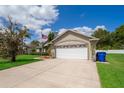 Charming single-Gathering home with a well-manicured lawn and a two-car garage at 2924 Jebidiah Loop, St Cloud, FL 34772