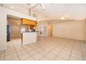 Spacious living room with tile floors, kitchen access and abundant natural light at 2924 Jebidiah Loop, St Cloud, FL 34772
