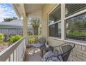 Cozy porch showcasing comfortable seating, ideal for relaxation and enjoying the outdoor views at 3001 Little Cypress Cv, Winter Park, FL 32792