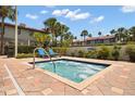 Community hot tub surrounded by lush landscaping, perfect for relaxation at 3118 Magic Kingdom Ct, Kissimmee, FL 34746