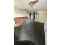 Image showing a living room in need of restoration with visible repairs and renovation opportunities at 31647 Mount Plymouth Loop, Sorrento, FL 32776