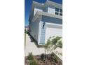 Light blue two-story home with a well-maintained yard and white trim at 4762 Sparkling Shell Ave, Kissimmee, FL 34746