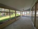 Enjoy the large screened lanai with tile flooring, perfect for relaxing and entertaining guests at 6042 Wade St, Leesburg, FL 34748