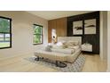 Elegant main bedroom with a comfortable queen-sized bed, stylish accent wall, and natural light at 6168 Sw 154Th St, Ocala, FL 34473