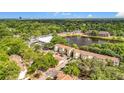 Scenic aerial view of the condo community with a pond and lush green surroundings at 960 Mooring Ave # 202, Altamonte Springs, FL 32714