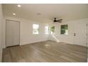 Bright living room features new floors and a ceiling fan at 1016 E Fillmore Ave, Orlando, FL 32809