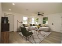 Bright living room featuring lots of natural light, modern furnishings, and neutral color palette at 1016 E Fillmore Ave, Orlando, FL 32809