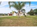 Charming single-story home with well-maintained lawn, mature trees, and an attached two-car garage at 1139 Humphrey Blvd, Deltona, FL 32738