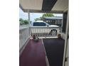 A cozy porch with brick accents and a view of the neighborhood at 138 Maple Dr, Debary, FL 32713