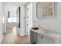 Bright hallway featuring modern decor, leading to the main living area with gorgeous floors at 150 E Robinson St # 2812, Orlando, FL 32801