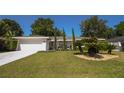 A quaint one-story home enhanced by a lush lawn and mature landscaping at 1529 Glastonberry Rd, Maitland, FL 32751