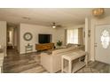 Cozy living room featuring modern floors, a comfortable sofa, and natural light at 1529 Glastonberry Rd, Maitland, FL 32751