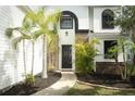 Picture of the front door of a well-maintained two-story home with landscaped front yard at 1645 Boulder Creek Ct, Apopka, FL 32712