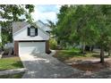 Picture of the front exterior of a two-story home with a two-car garage and a well-manicured front lawn at 1645 Boulder Creek Ct, Apopka, FL 32712