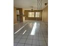 Open-concept living area featuring tile flooring and a decorative room divider at 3040 Pinder Ct, Orlando, FL 32811