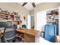 Office with a desk, ceiling fan, closet, and neutral-colored walls at 329 Alegriano Ct, Kissimmee, FL 34758