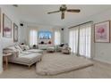 Bright living room featuring neutral decor, a plush rug, and plenty of natural light from large windows at 334 Terrace Dr, Oviedo, FL 32765