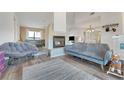 Cozy living room featuring a fireplace, comfortable seating, and a serene ambiance at 516 Fort Smith Blvd, Deltona, FL 32738