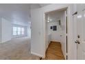 Open concept featuring a living room and entryway to laundry room, offering seamless flow and convenience at 5500 Metrowest Blvd # 203, Orlando, FL 32811