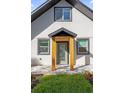 Stunning front entrance features a glass door, wood columns, and paver walkway at 600 Lakewood Ave, Ocoee, FL 34761