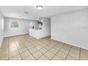 Bright open living room with tile flooring and neutral walls offers great natural light at 619 Carver Dr, Lake Wales, FL 33853