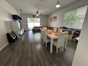 Spacious living room with wood floors, natural light, and an open layout perfect for entertaining and Gathering gatherings at 9959 Cypress Vine Dr, Orlando, FL 32827